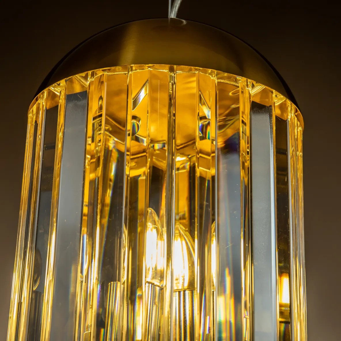 close up of large 6 light pendant light brass